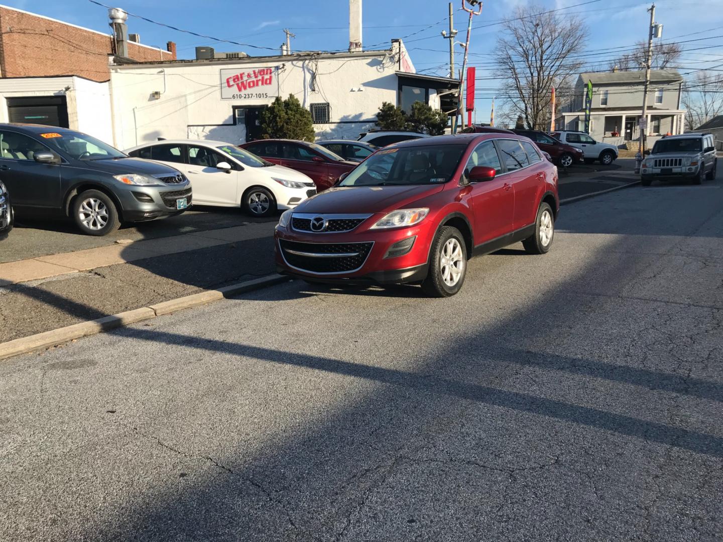 2012 Red /Tan Mazda CX-9 Touring (JM3TB3CV5C0) with an 3.7 V6 engine, Automatic transmission, located at 577 Chester Pike, Prospect Park, PA, 19076, (610) 237-1015, 39.886154, -75.302338 - Photo#1